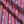 Morello linen by Bethie Tricks in red and blue, in soft folds showing block-print stripes