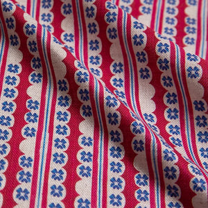 Morello linen by Bethie Tricks in red and blue, in soft folds showing block-print stripes