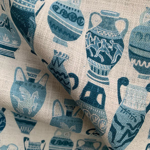 Muggle of Jugs linen by Annika Reed in blue, in soft folds showing painted jugs and vases