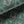 Mumbai Deco velvet by Tatie Lou in teal, draped, showing Deco fan shapes