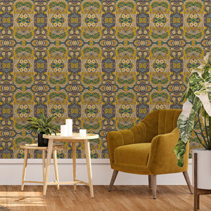 Esprit wallpaper by Tatie Lou in mustard, an ornate medallion print behind a sofa in a living room