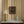 Somerset Stripes wallpaper by Annika Reed in yellow, painted stripes above a cabinet