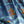 Nui Burst velvet by Tatie Lou in blue and orange, draped, showing shibori-style bursts
