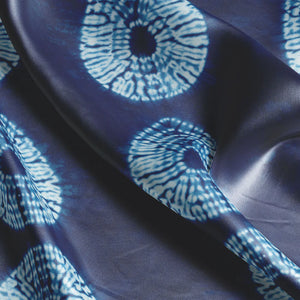 Indigo Nui velvet by Tatie Lou in indigo blue, draped, showing nui shibori dots