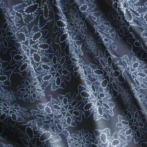 Indigo Nui velvet by Tatie Lou in indigo blue, in soft folds showing nui shibori dots
