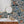 Ocean Waves wallpaper by Brand McKenzie in navy, sea creatures in rolling waves on a bathroom wall