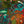 Octopus wallpaper by Brand McKenzie in olive, close view of octopus and sea life