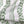 Olive linen by Annika Reed in green, draped, showing olive branch stripes