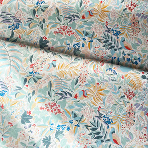 Olympia linen by Claire de Quénetain in pink and green, draped, showing a hand-painted floral design