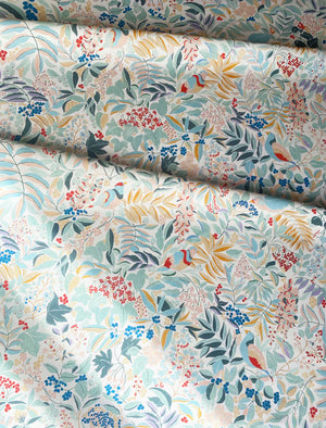 Olympia linen by Claire de Quénetain in pink and green, draped, showing a hand-painted floral design