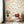 Dancing Autumn Daisies wallpaper by Seed Home Designs in orange and green, orange daisies on tall stems in a living room