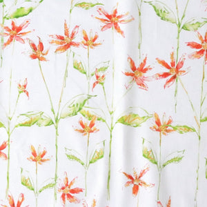 Dancing Autumn Daisies linen by Seed Home Designs in orange and green, full repeat of orange daisies on tall stems