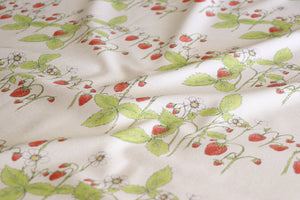 Organic Strawberry Patch linen by Seed Home Designs in red and green, draped close-up of strawberries and flowers