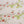 Organic Strawberry Patch linen by Seed Home Designs in red and green, in soft folds showing strawberries and flowers