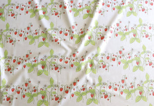 Organic Strawberry Patch linen by Seed Home Designs in red and green, draped, showing strawberries and flowers