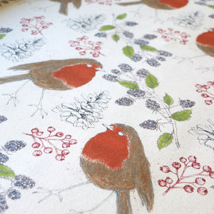 Organic Turn of the Seasons Robin linen by Seed Home Designs in orange and green, draped, showing robins among foliage