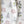 Organic Turn of the Seasons Pinecone and Berry linen by Seed Home Designs in green and red, draped, showing
