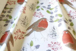Organic Turn of the Seasons Robin linen by Seed Home Designs in orange and green, flat sample of robins among foliage