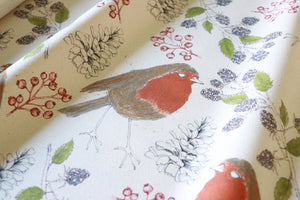 Organic Turn of the Seasons Robin linen by Seed Home Designs in orange and green, full repeat of robins among foliage