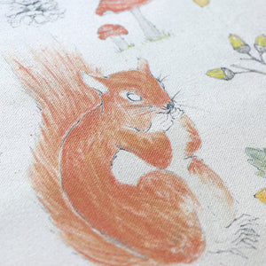 Organic Turn of the Seasons Squirrel linen by Seed Home Designs in brown and green, flat sample of squirrels among foliage
