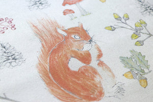 Organic Turn of the Seasons Squirrel linen by Seed Home Designs in brown and green, flat sample of squirrels among foliage