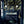 Pachamama wallpaper by Tatie Lou in navy, flying cranes in a bathroom