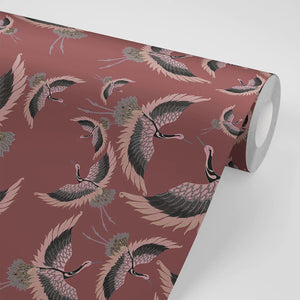 Pachamama wallpaper by Tatie Lou in burgundy, sample roll showing flying cranes