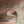 Pachamama wallpaper by Tatie Lou in pink and teal, flying cranes upholstered on an armchair