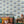 Pair of Dogs wallpaper by Annika Reed in blue, pairs of dogs and vases in a living room