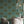Palma wallpaper by Deus ex Gardenia in teal, tall palm trees in a dining area