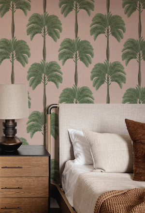 Palma wallpaper by Deus ex Gardenia in pink and green, tall palm trees in a bedroom