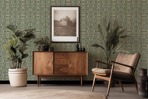 Papilio wallpaper by Victoria Sanders in green, a mirrored butterfly design behind a console table
