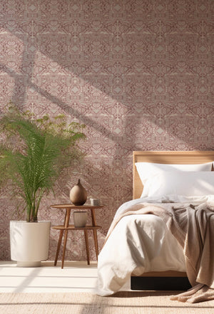Papilio wallpaper by Victoria Sanders in pink, a mirrored butterfly design behind a bed