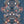 Paradise Party wallpaper by Brand McKenzie in navy, close-up of a mirrored tropical party scene