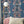 Paradise Party wallpaper by Brand McKenzie in pink, a mirrored tropical party scene in a living room