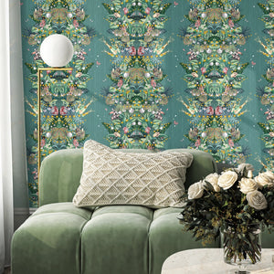 Paradise Party wallpaper by Brand McKenzie in green, a mirrored tropical party scene in a living room