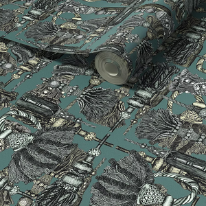 Passementerie wallpaper by Dami and Em Design in dark green, partly unrolled roll showing tassels and trimmings