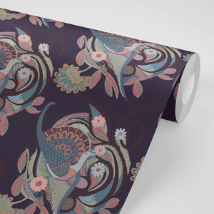 Phoenix wallpaper by Tatie Lou in navy, partly unrolled roll showing swirling phoenix feathers