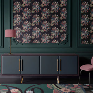 Phoenix wallpaper by Tatie Lou in navy, swirling phoenix feathers behind a sofa in a living room