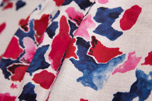 Pink and Blue linen by Bethie Tricks in pink and blue, draped, showing painted blooms