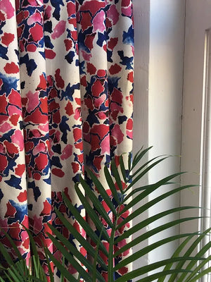 Pink and Blue linen by Bethie Tricks in pink and blue, painted blooms made into curtains