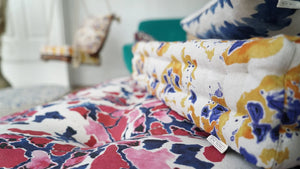 Pink and Blue linen by Bethie Tricks in pink and blue, draped close-up of painted blooms