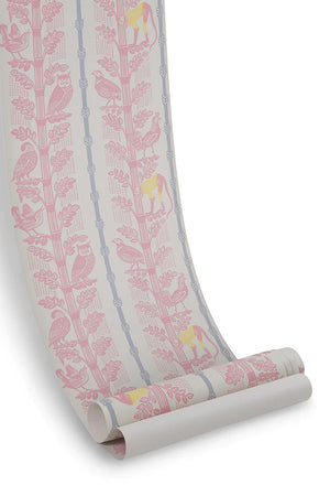 Monkeys and Birds wallpaper by St. Jude's in pink, partly unrolled roll showing monkeys and birds on stems