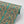 Plume wallpaper by Tatie Lou in teal, roll showing Deco plumes