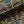 Plume velvet by Tatie Lou in navy and gold, draped close-up of Deco plumes