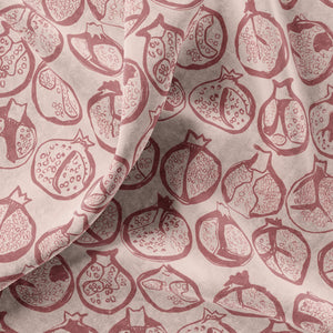 Pomegranate velvet by Annika Reed in pink, draped close-up of pomegranates