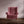 Pomegranate linen by Annika Reed in burgundy, pomegranates upholstered on an armchair