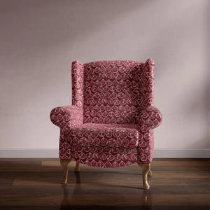 Pomegranate velvet by Annika Reed in burgundy, pomegranates on an upholstered chair