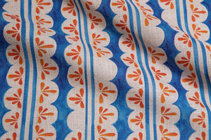 Pool Party linen by Bethie Tricks in blue and orange, draped, showing painted pool stripes