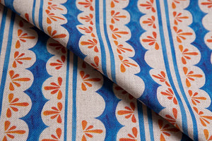 Pool Party linen by Bethie Tricks in blue and orange, in soft folds showing painted pool stripes